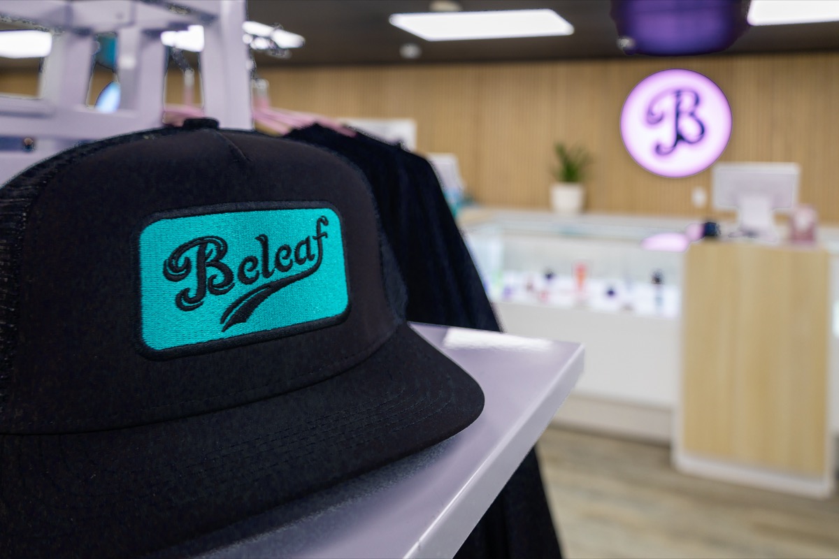 Beleaf branded teal hat with B logo at Calverton store